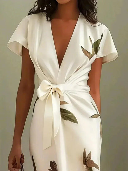 Evie - Elegant blommig omlottklänning