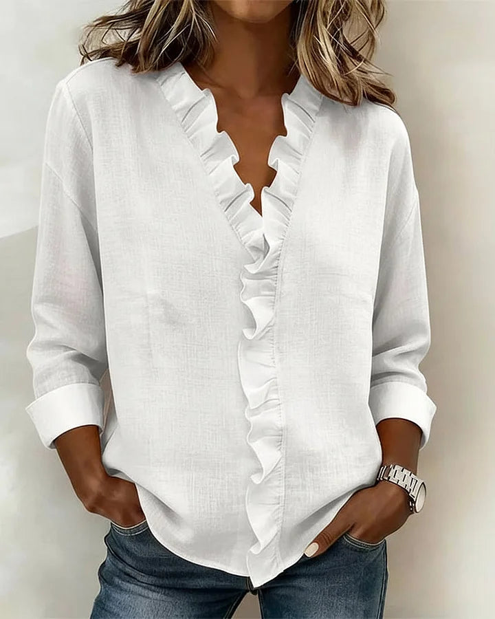 Delilah - Blus med volang och v-ringning