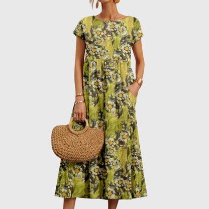 Elsie - Elegant, böljande blommig klänning