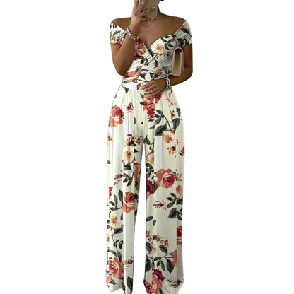 CHYNA™ – Blommig jumpsuit med bara axlar och omlott