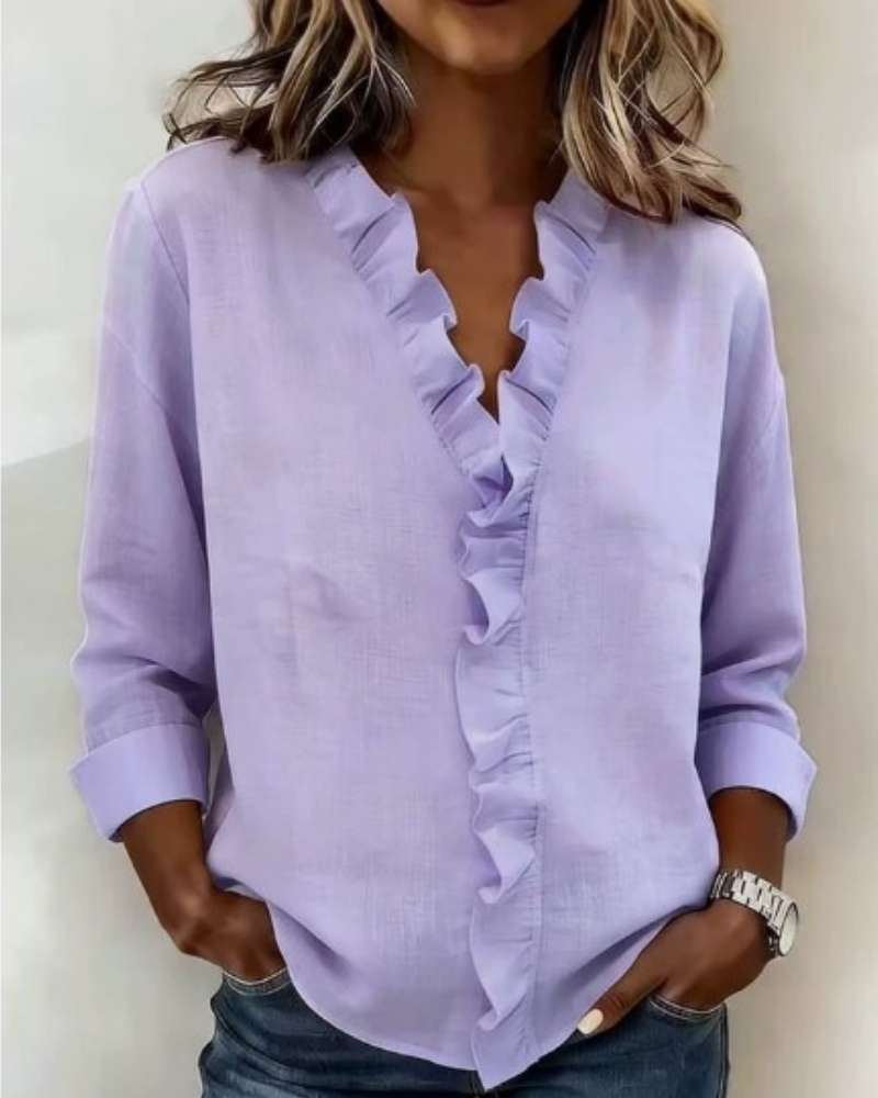 Delilah - Blus med volang och v-ringning