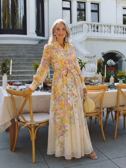 Cressida - Blommig, transparent maxiklänning med långa ärmar